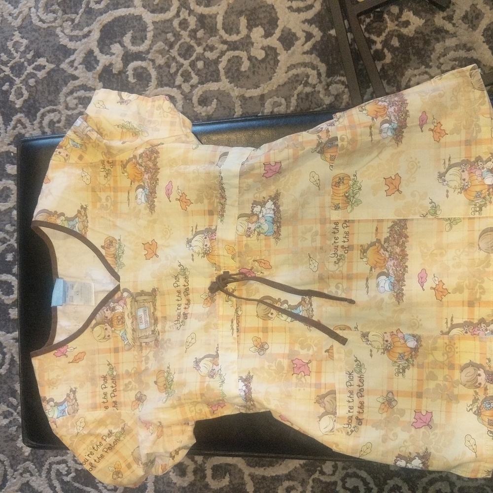 Precious Moments size XS scrub top. Has been gently worn.